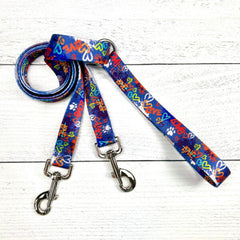 Colorful "Love" graffiti-style dog leash with heart and paw print pattern on blue double connection leash by 2 Hounds Design. - Earthstyle